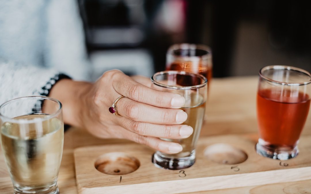 clear drinking glass on brown wooden coaster