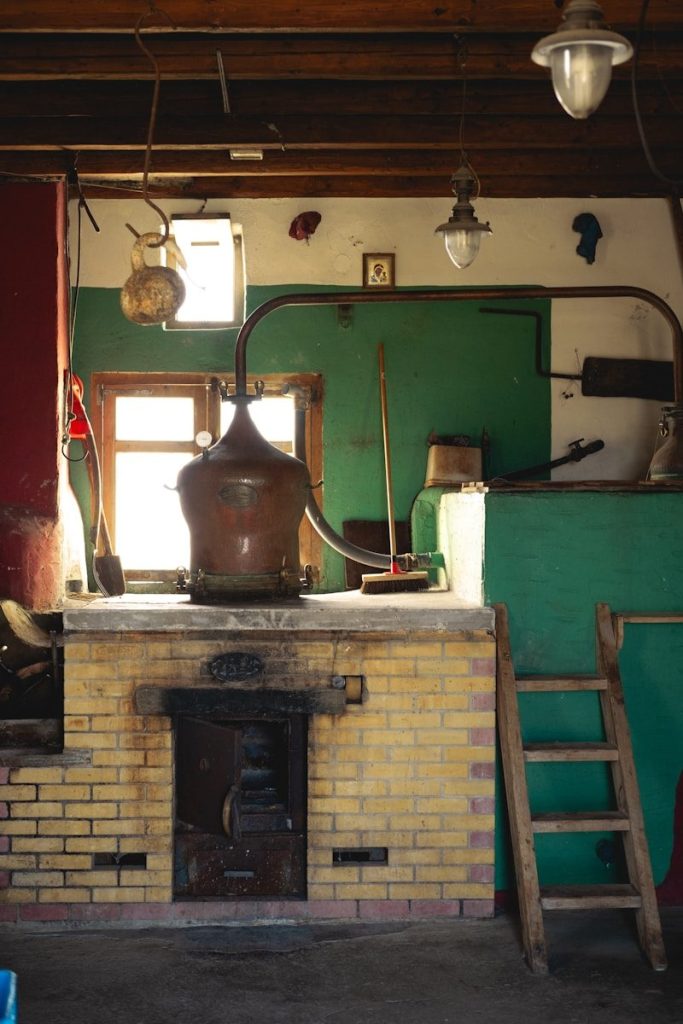 A room with a fire place and a ladder